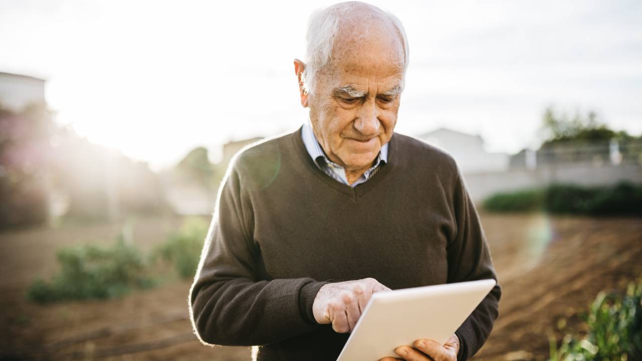  senior-man-using-tablet